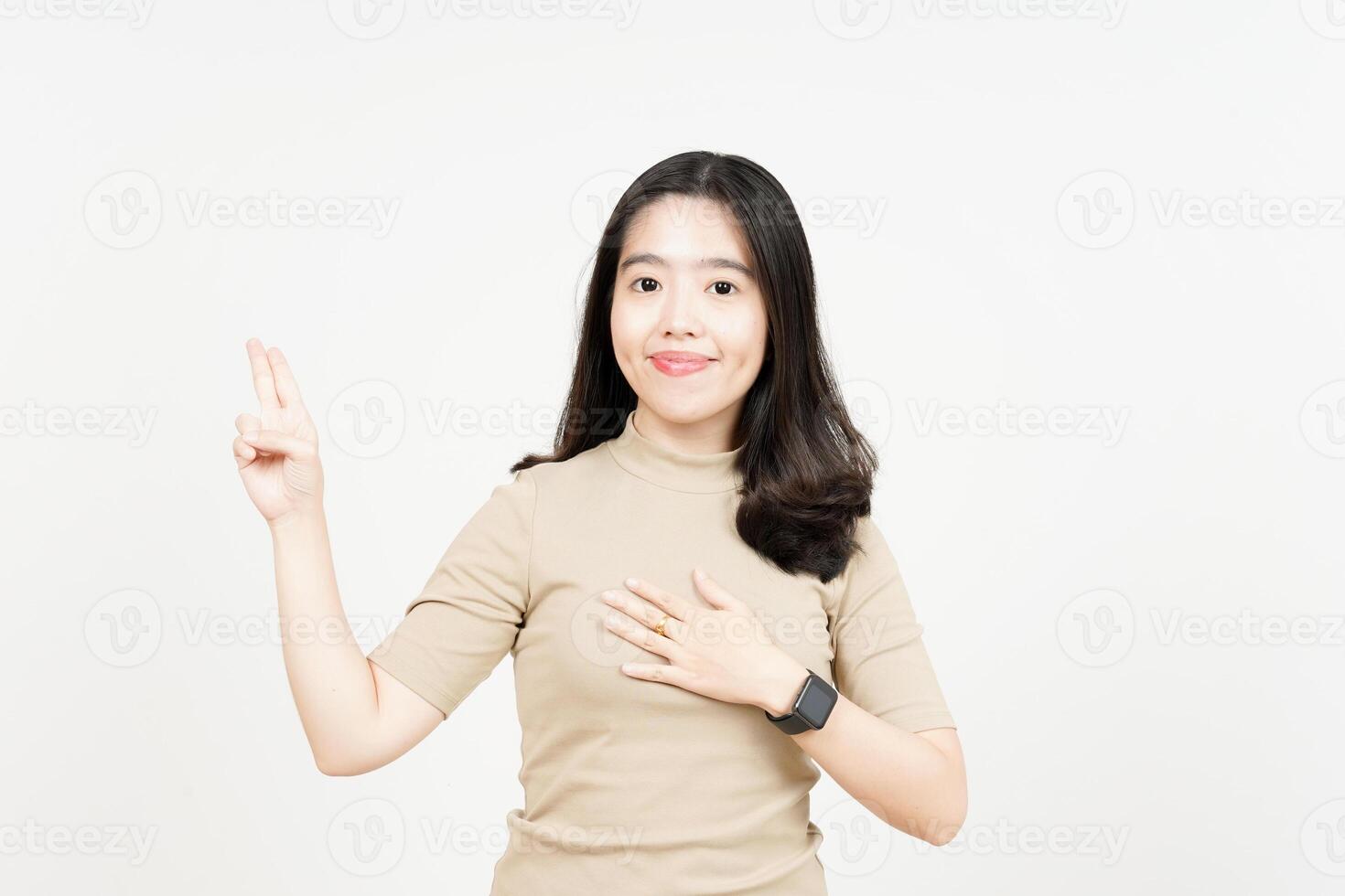 Swearing or Promise Gesture Of Beautiful Asian Woman Isolated On White Background photo