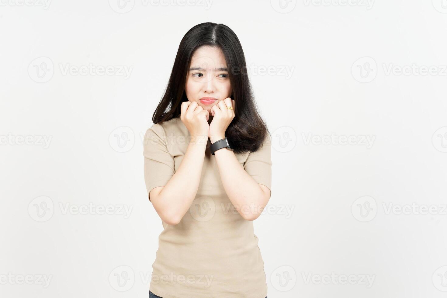 Hands Under Chin with Sad Face Expression Of Beautiful Asian Woman Isolated On White Background photo