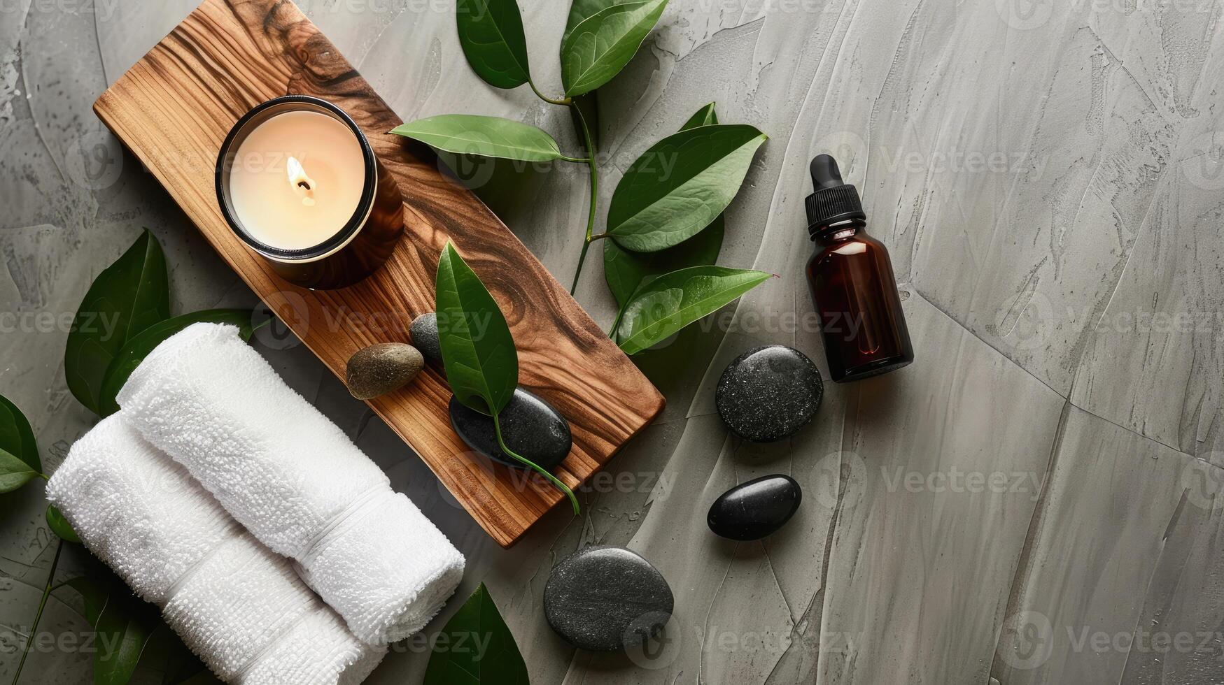 Spa products on a wooden tray with a candle and leaves photo