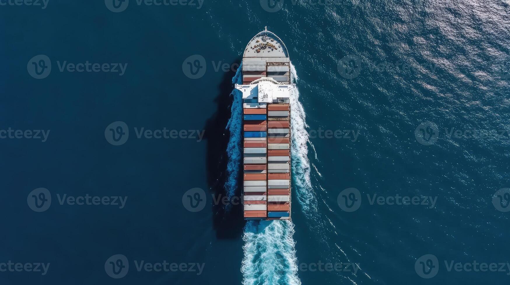 An aerial view of a container ship traveling through the ocean photo