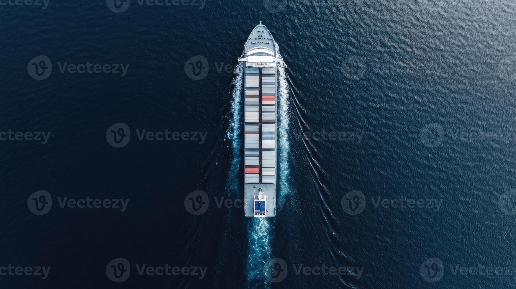 An aerial view of a container ship traveling across the ocean photo