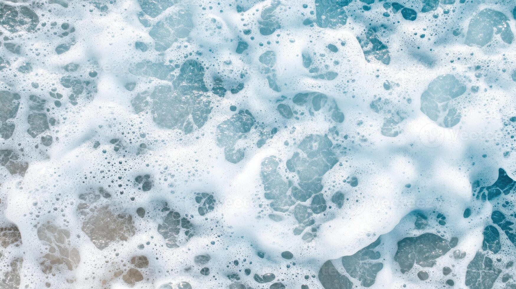 A close up of a wave with white foam photo