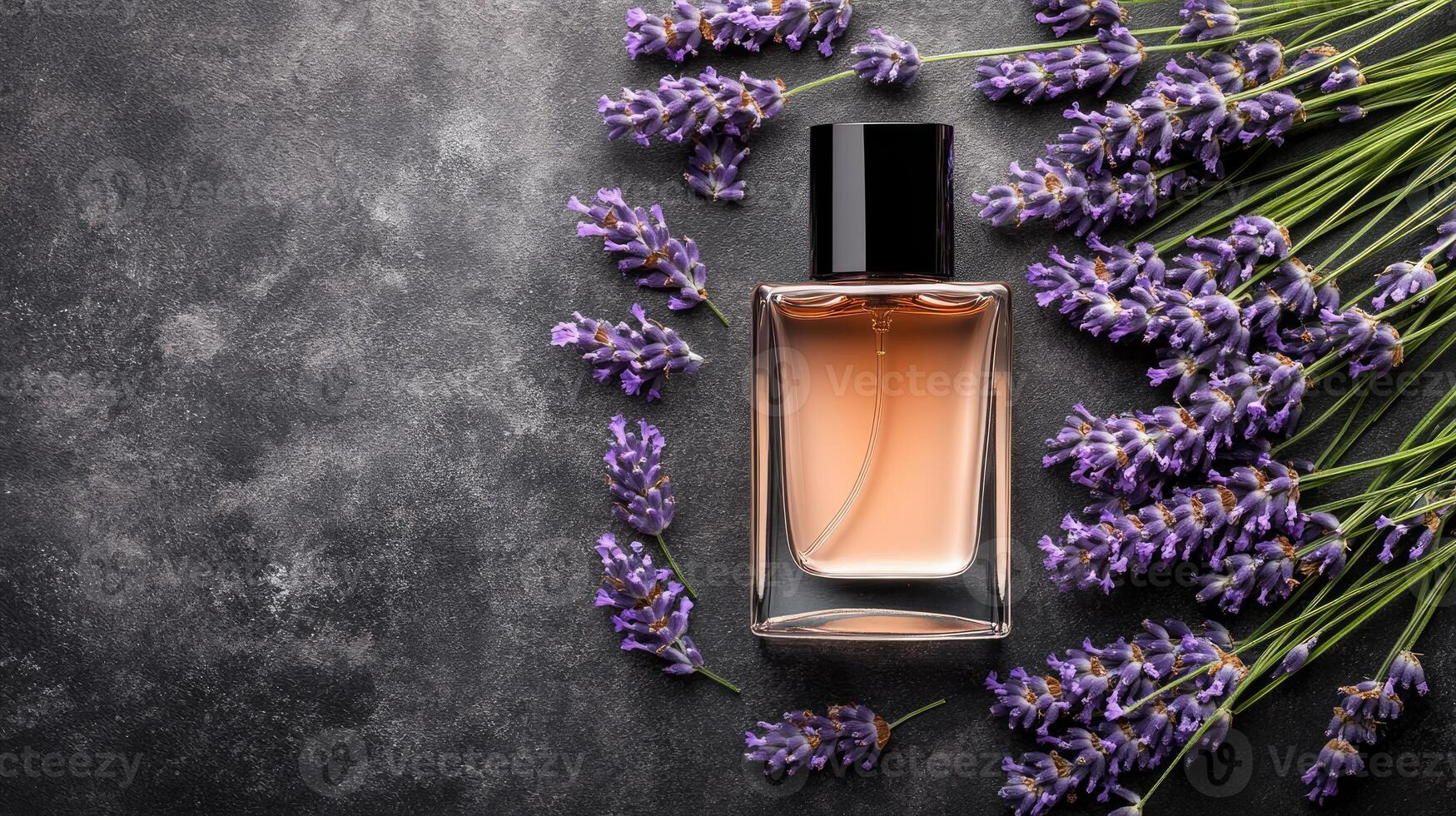 Lavender flowers and perfume bottle on dark background photo