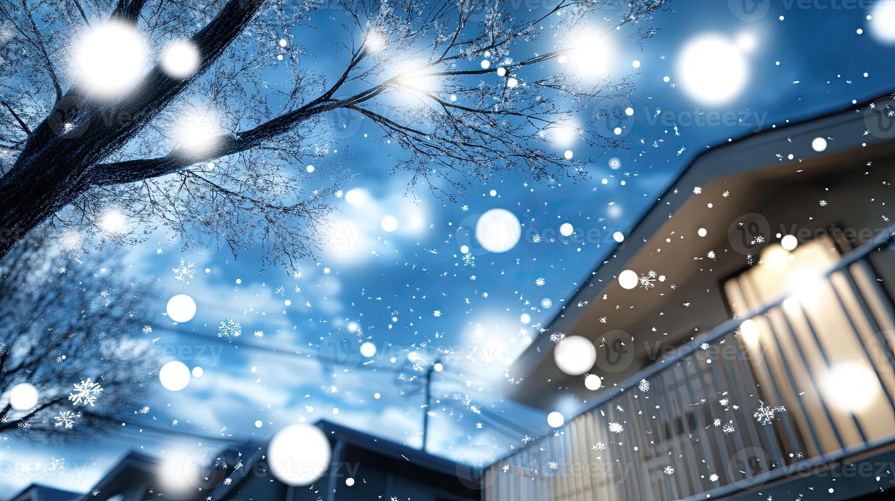A house with snow falling on it and a tree photo