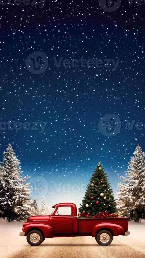 A red truck with a christmas tree on the back in the snow photo