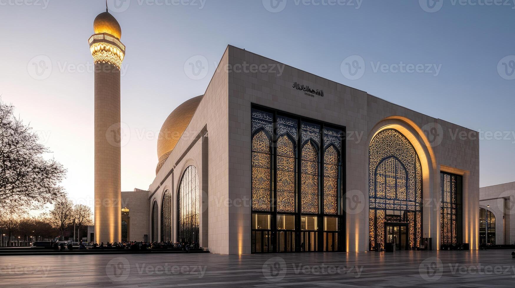 The mosque is lit up at dusk photo