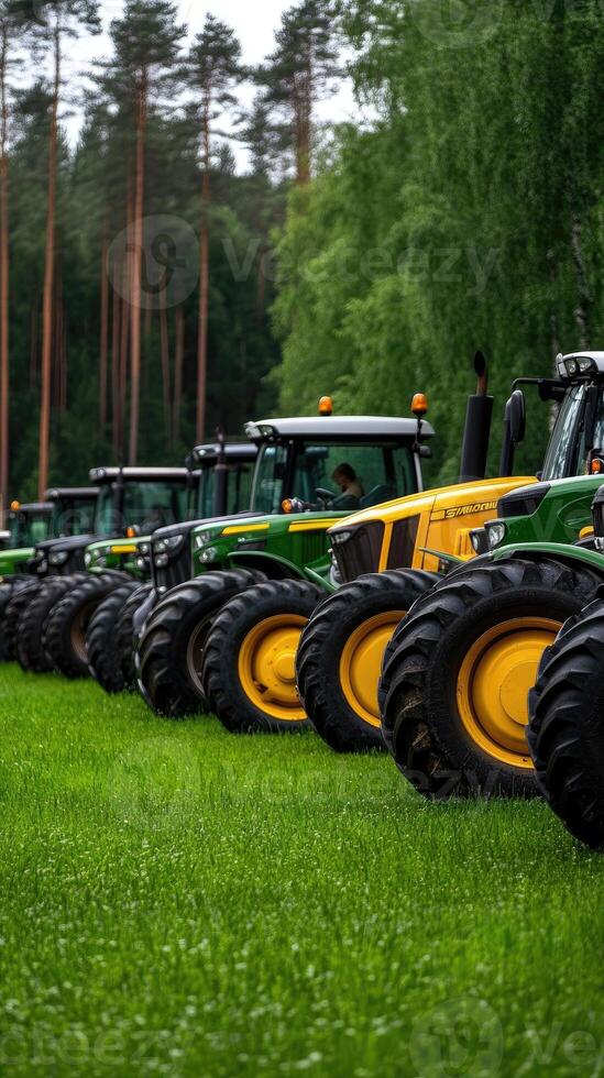 A row of green and yellow tractors in a field photo