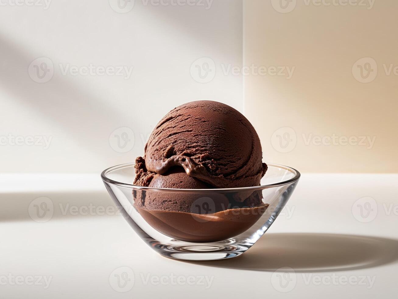 Rich Chocolate Ice Cream Scoop in a Glass Bowl photo