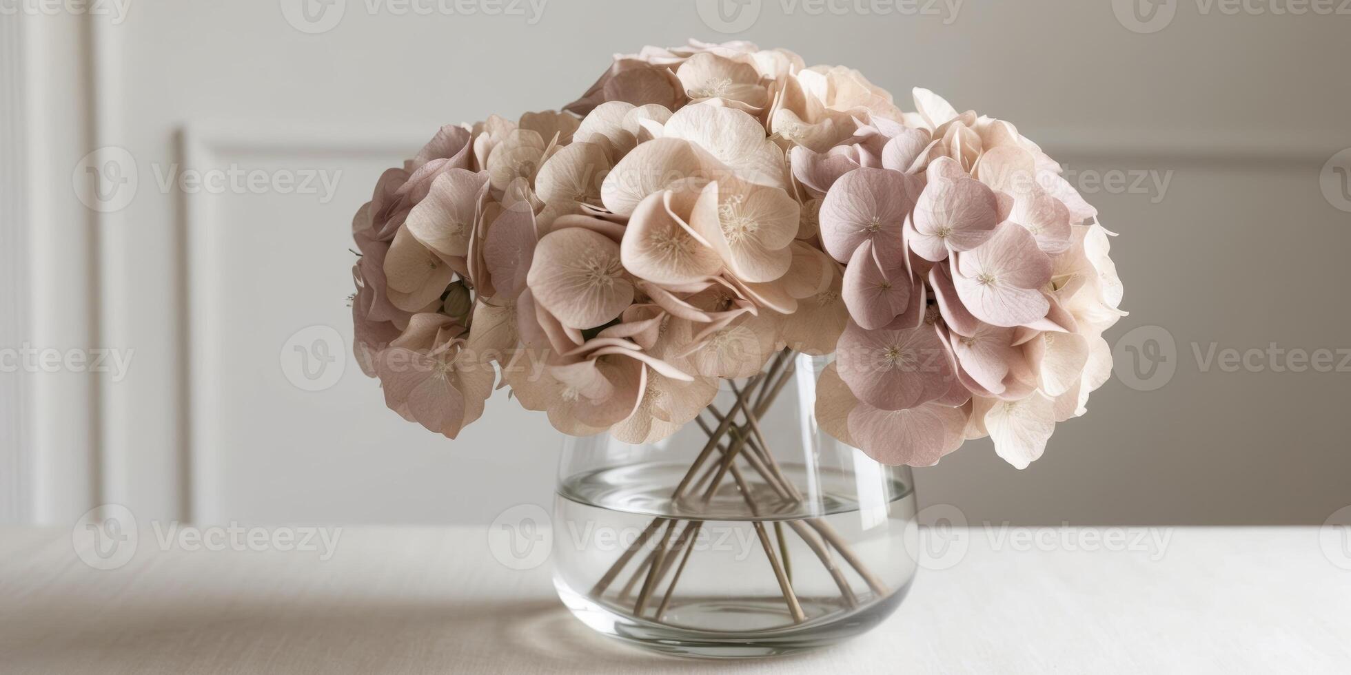 Exquisite Display of Fluffy Dried Hydrangeas in Soft Pastel Shades Perfectly Arranged in a Clear Vase for Home Decor photo