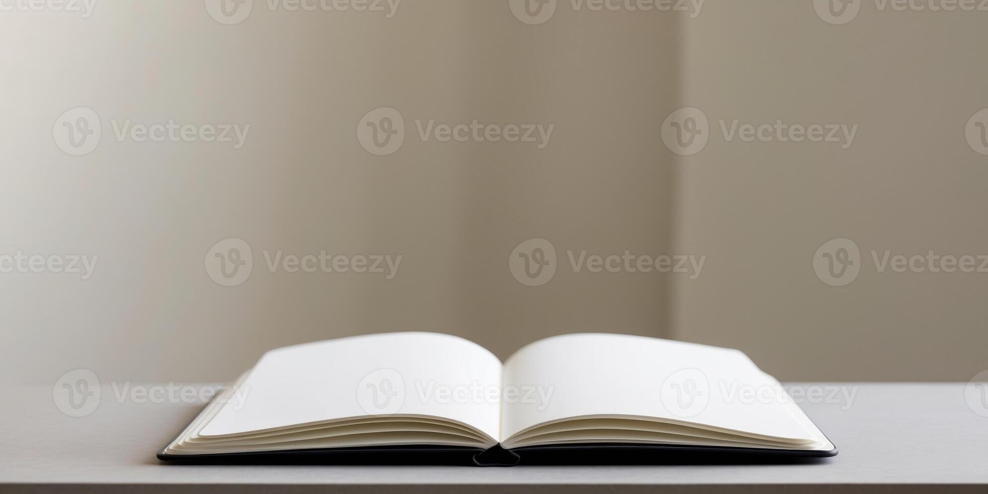 An open notebook with blank white pages lies on a flat surface photo