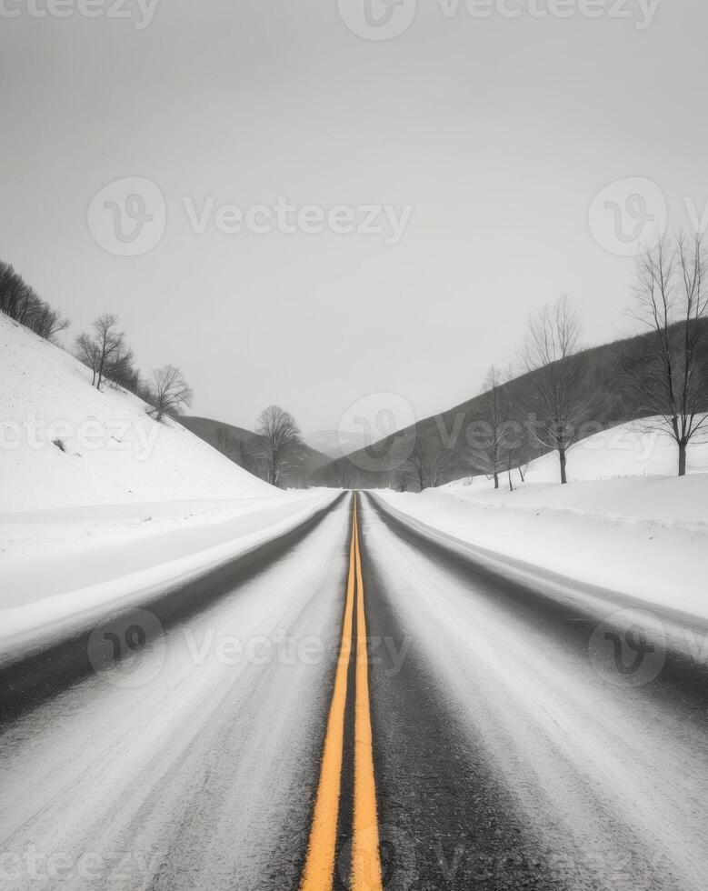 Winter Road Scene Snowy Asphalts and Yellow Line photo