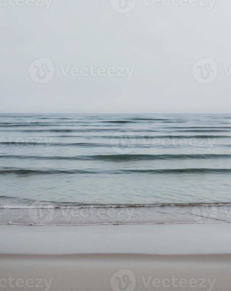 Peaceful Shoreline with Blue Ocean Waves Background photo
