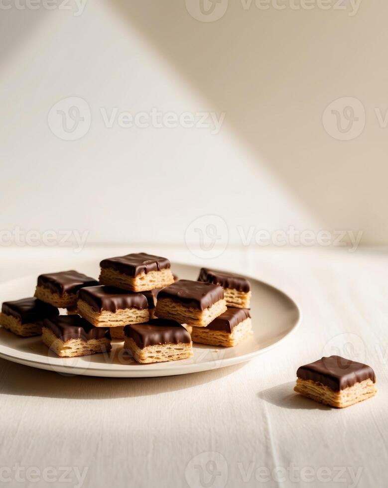 Chocolate and peanut butter bars on a plate photo