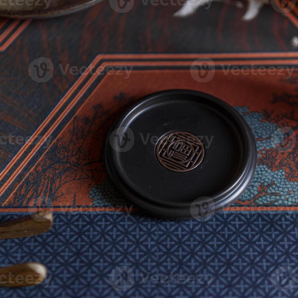 An Elegant Black Plate Perfectly Set Against a Stylish and Decorative Background photo