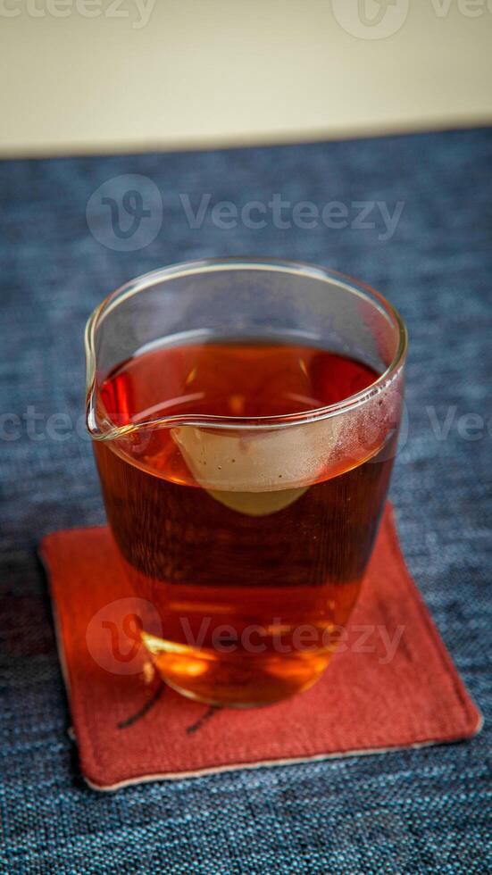 A warm mug of tea placed on a beautiful coaster, perfect for a calming afternoon vibe photo