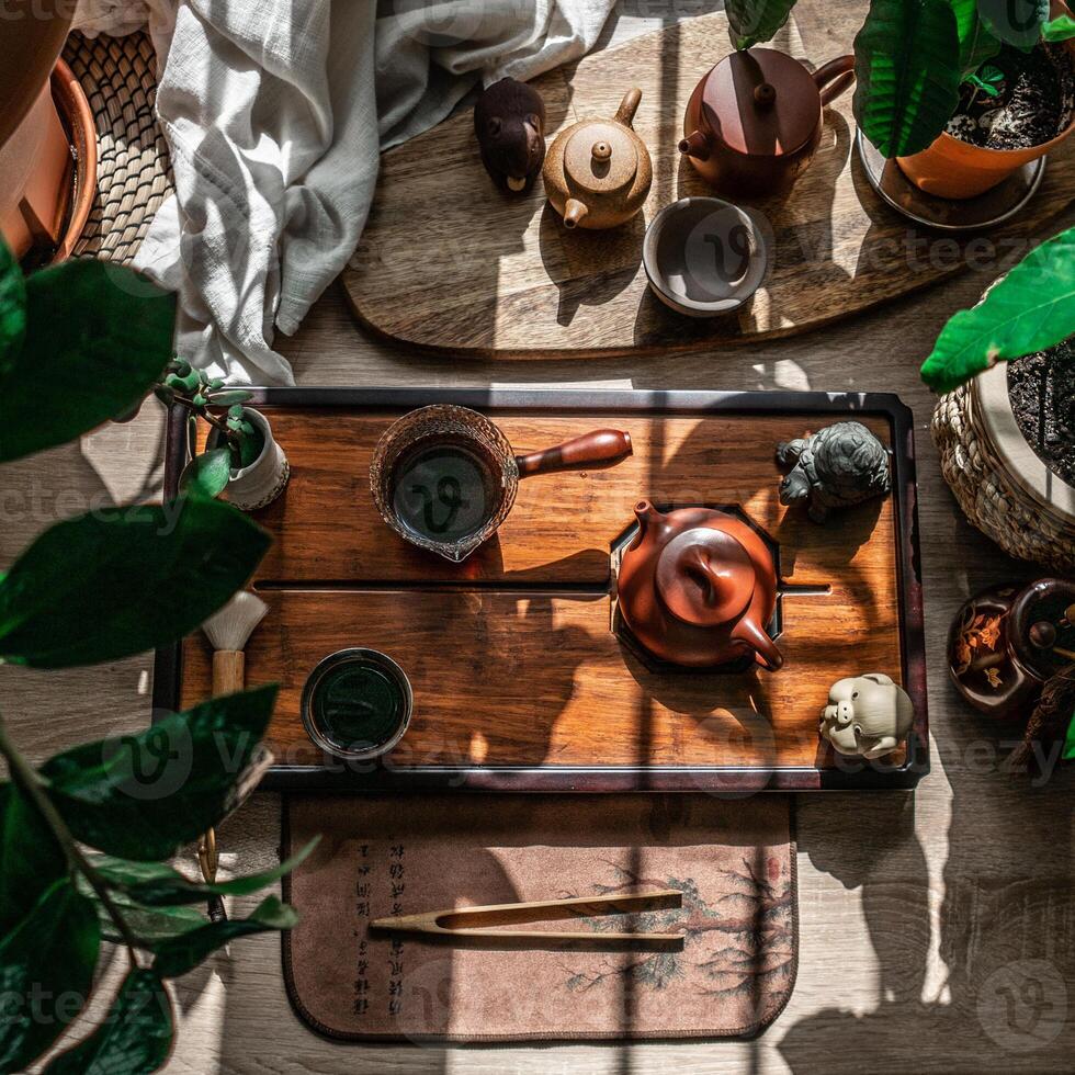 A Relaxing and Serene Tea Setup Incorporating Natural Elements and Abundant Greenery photo
