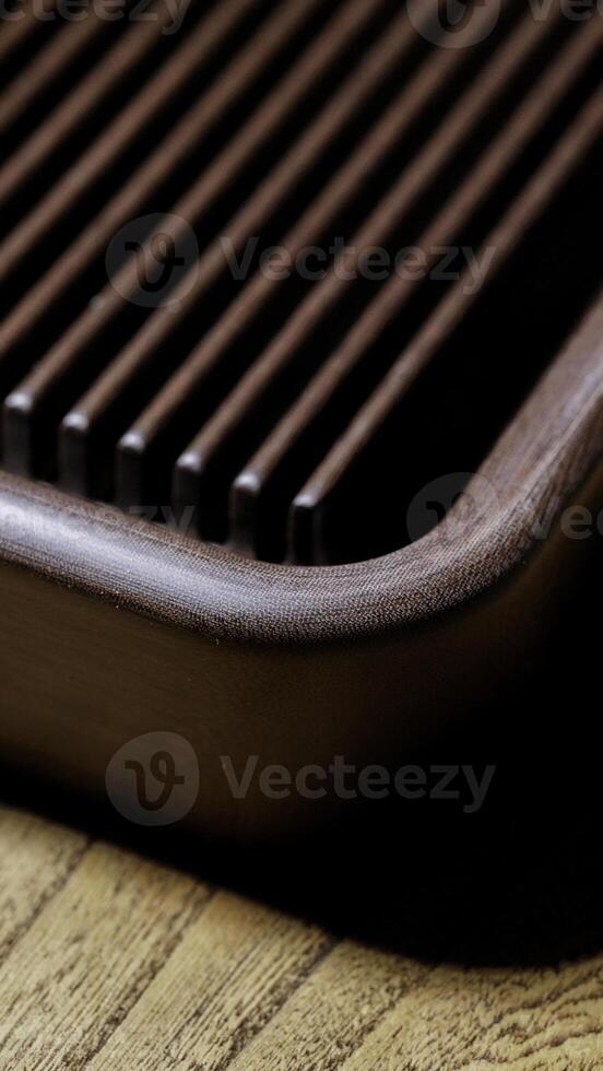 An Elegant Wooden Board featuring Beautiful Grooves, Perfect for a Gourmet Display Setting photo