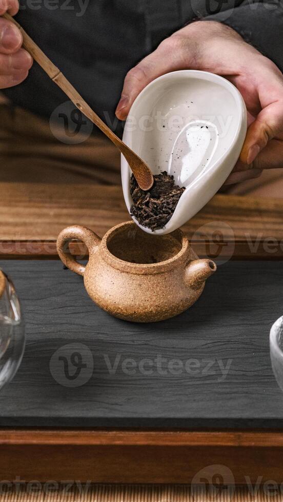 Artisan Tea Preparation Featuring an Exquisite and Unique Teapot Design for Brewing photo
