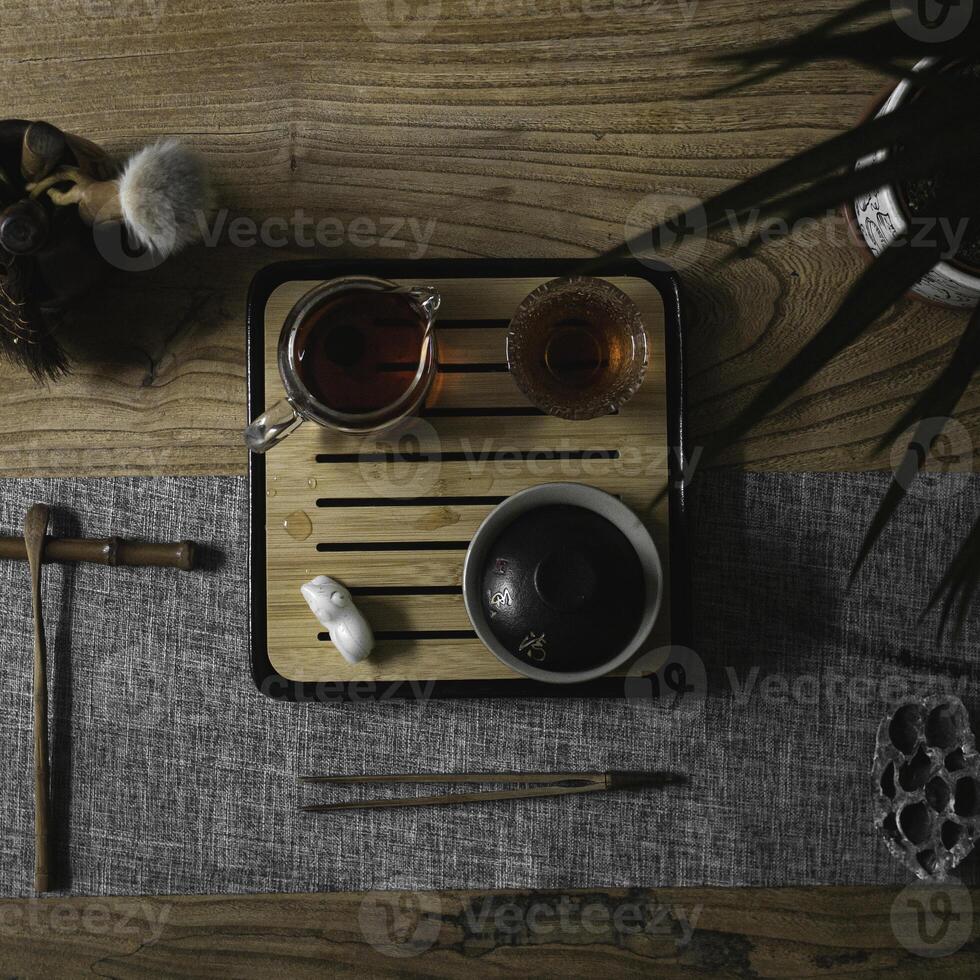 An Elegant Tea Setup Artfully Displayed on a Beautiful Wooden Table for Enjoyment photo