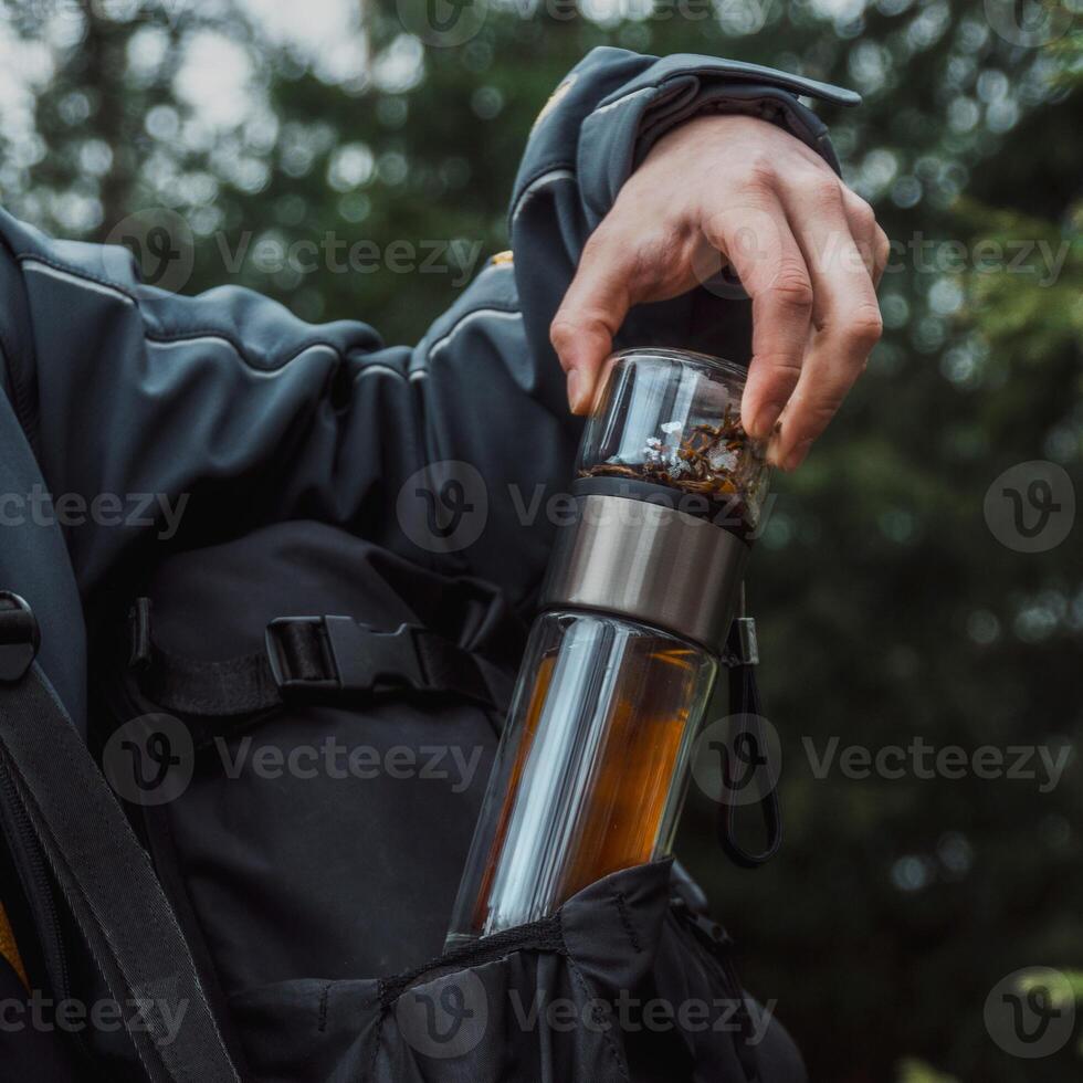 Engage in an exciting Outdoor Adventure equipped with a Travel Tea Infuser and Water Bottle photo