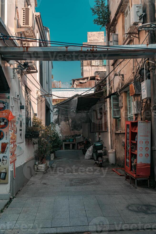 Charming Alleyway in a Vibrant and Lively Urban Landscape That Is Full of Life and Culture photo