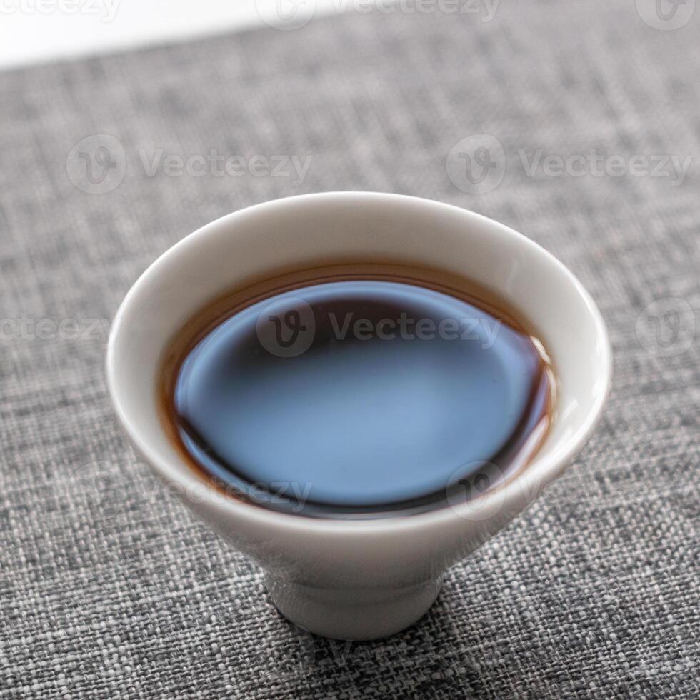 An elegantly crafted teacup filled with rich brew for a delightful and satisfying sip photo