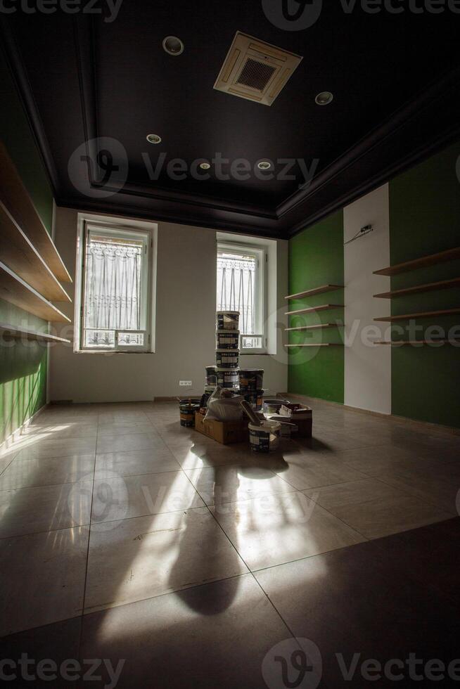 A modern minimalist interior design with dramatic lighting and refreshing green walls photo