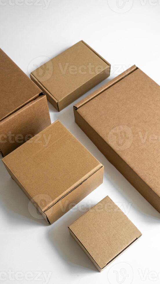 Sturdy brown cardboard boxes in various sizes for shipping and storage purposes photo
