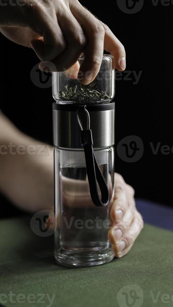 Hand Grinding Various Spices with a Stylish and Modern Grinder for Your Culinary Adventures photo