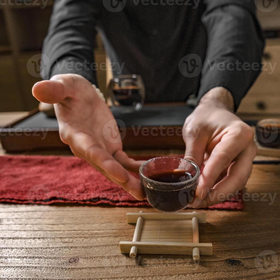 The Art of Tea Ceremony with a Rich Dark Brewed Beverage Focused on Flavor and Experience photo