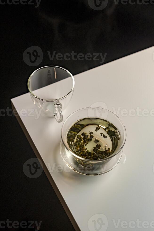 An Elegant Green Tea Presentation Arranged Artfully on a Minimalist Table Setting photo