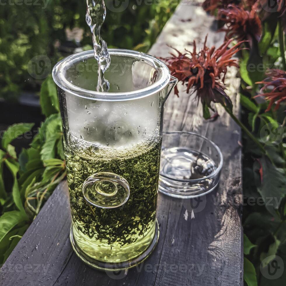 Enjoy a Refreshing Herbal Drink while immersed in the tranquility of Natures Embrace photo