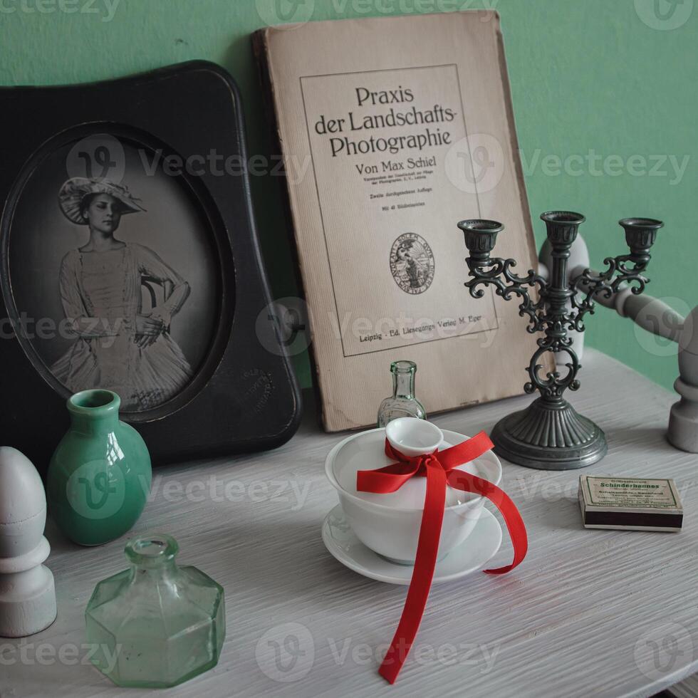 An exquisite vintage still life arrangement featuring an array of charming retro elements photo