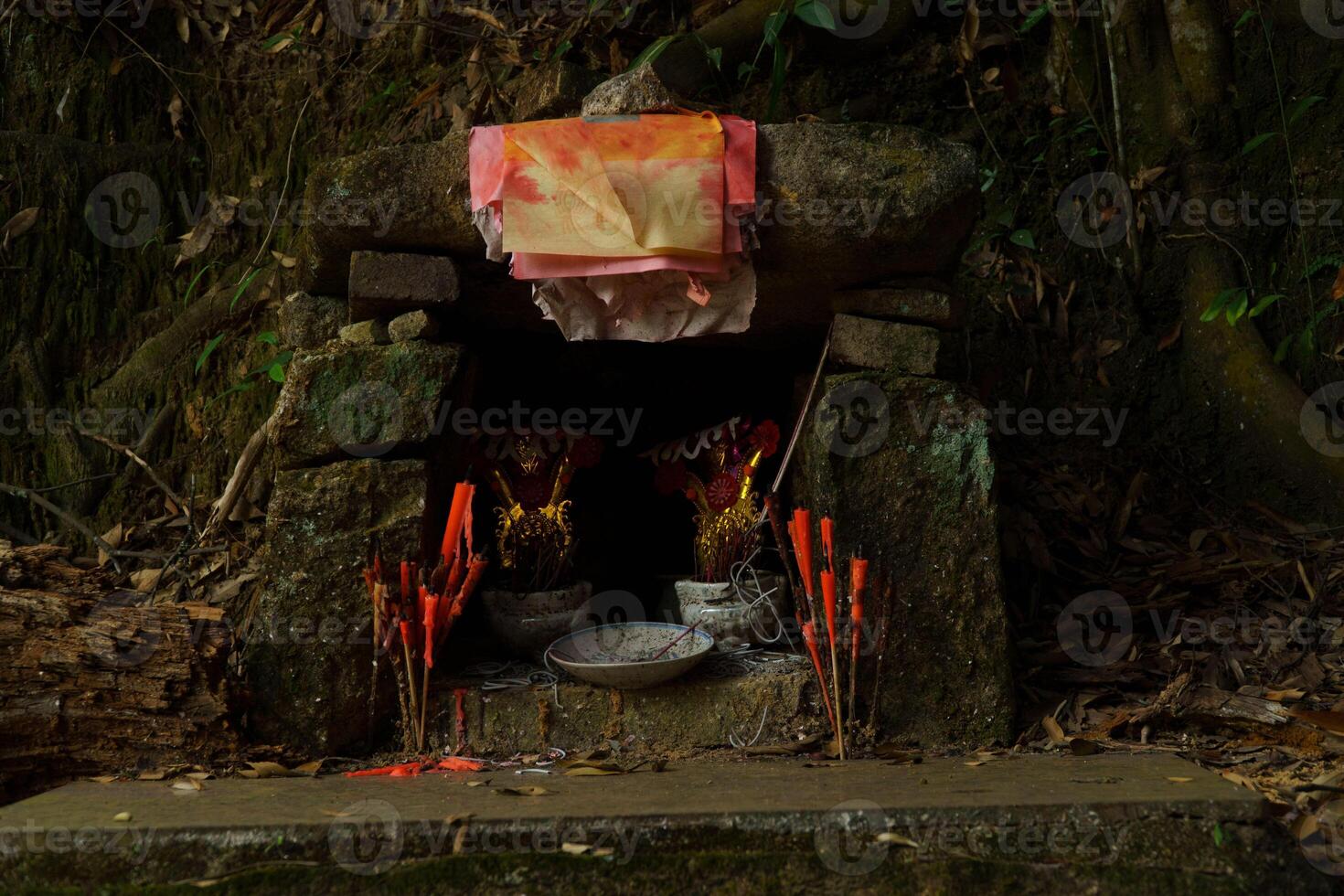 A Serene and Quiet Shrine Calmly Surrounded by the Beauty of Nature all Around It photo
