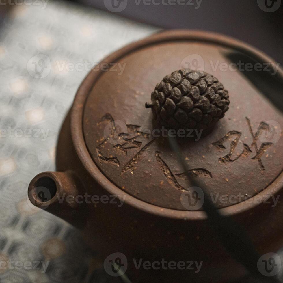 An Elegant Teapot with a Beautifully Intricate Design Features a Natural Lid and Flair photo