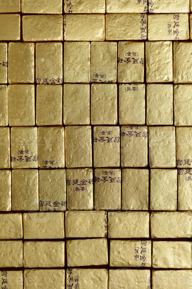 Stacks of Gleaming Gold Bars Shine Brightly in the Spotlight, Representing Wealth and Value photo