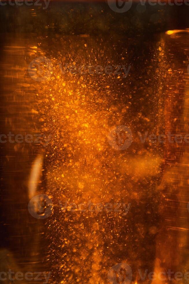 Stunning Abstract Artwork Featuring Light and Bubbles Dancing in a Beautiful Golden Liquid photo