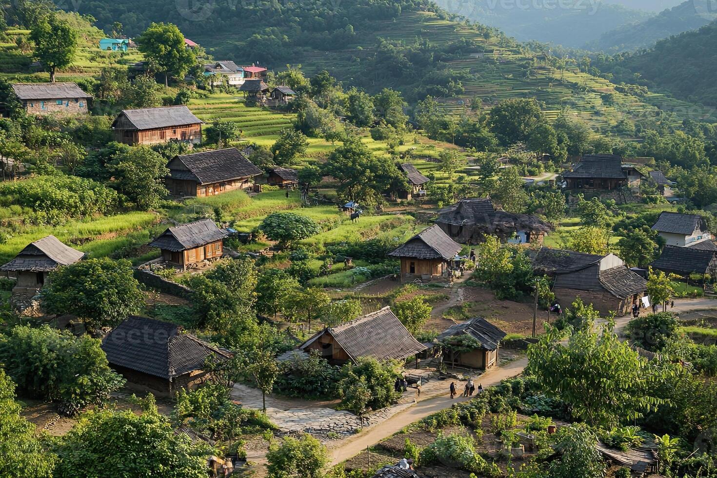 Hillside village with traditional houses and terraced fields. photo