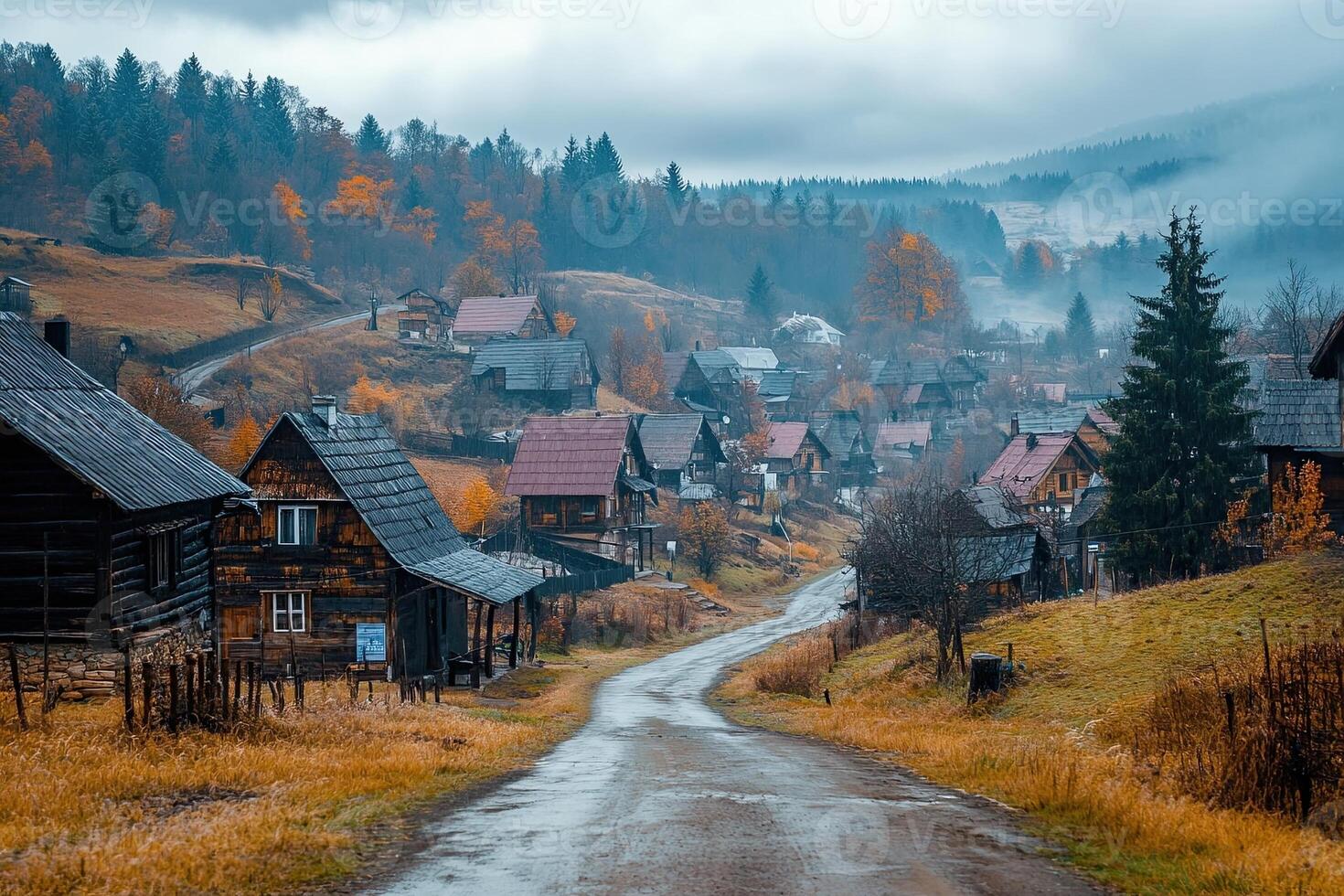 Misty mountain village road with autumn colors and traditional wooden houses. photo