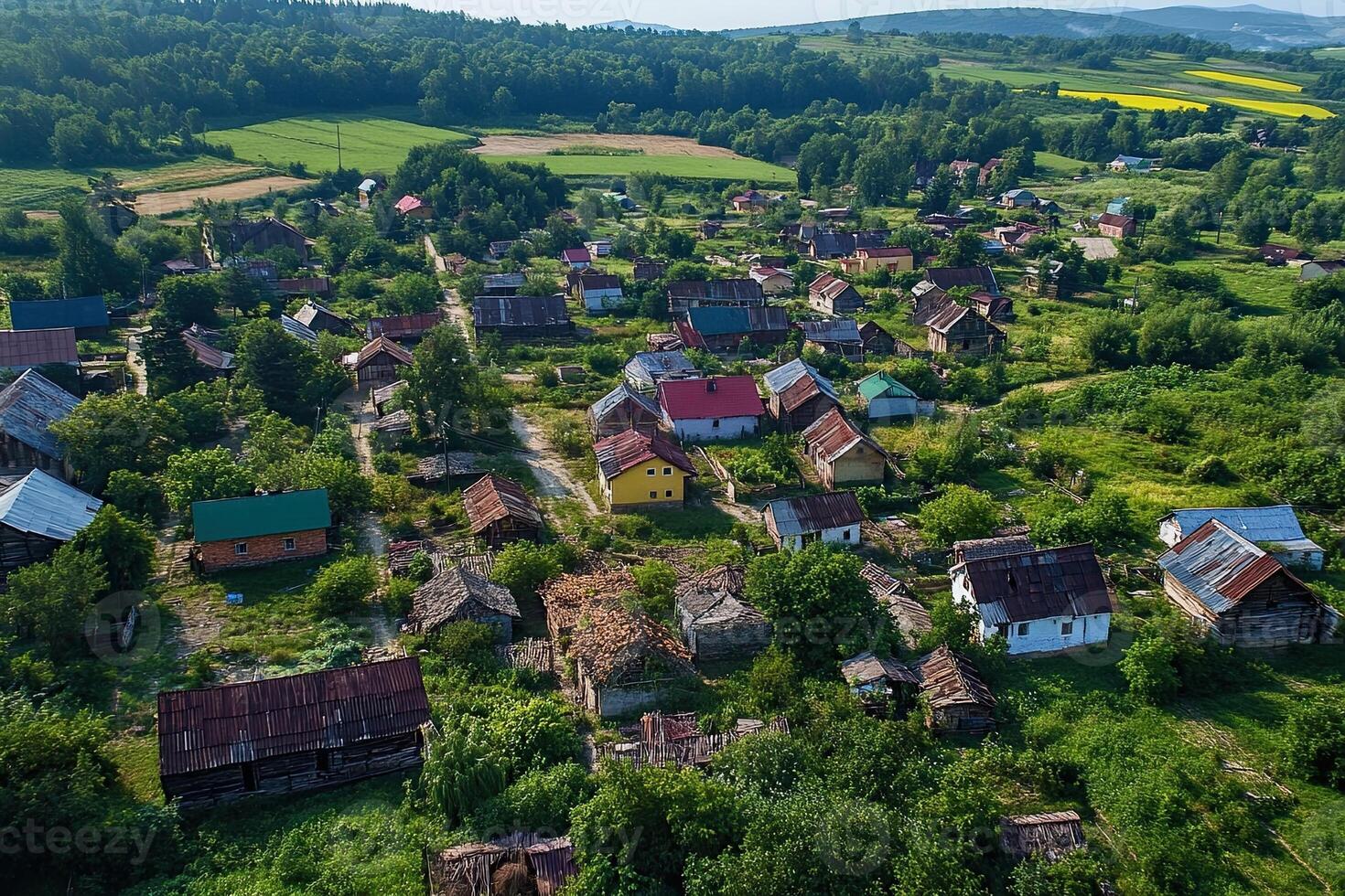 Aerial view of a small village with colorful houses and green fields. photo