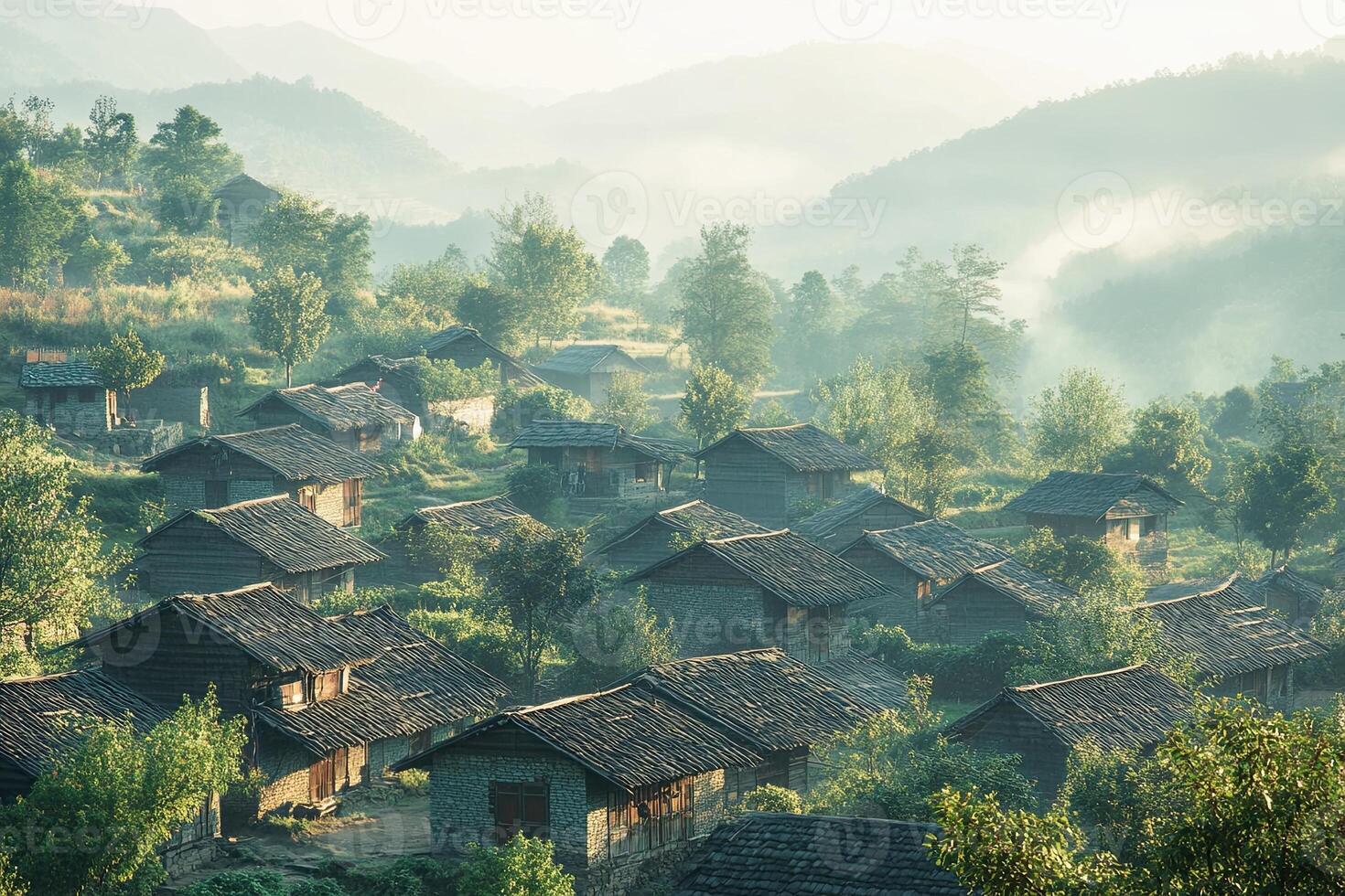 Misty mountain village with traditional houses at sunrise. photo