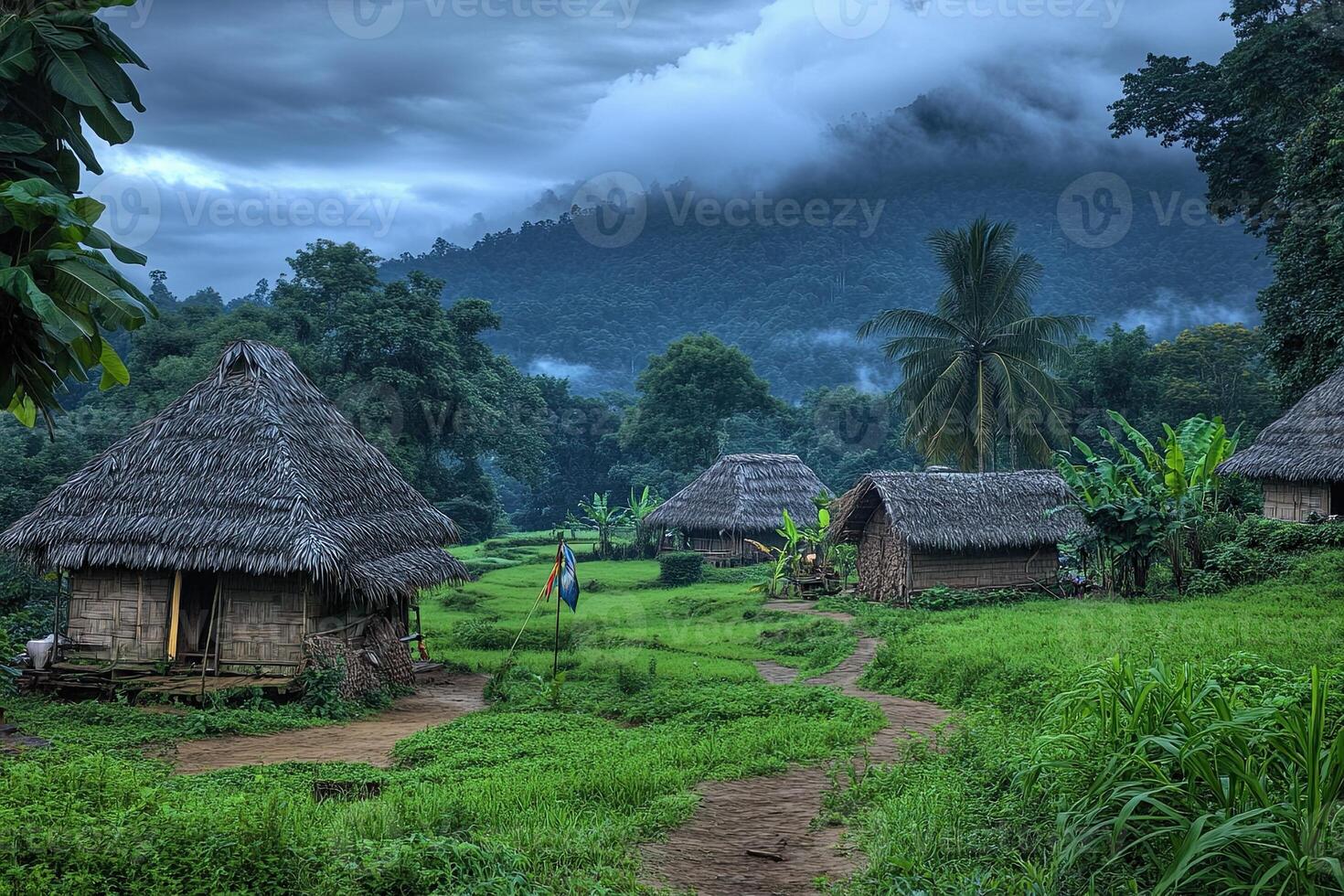 Misty mountain village with thatched huts and rice paddies. photo