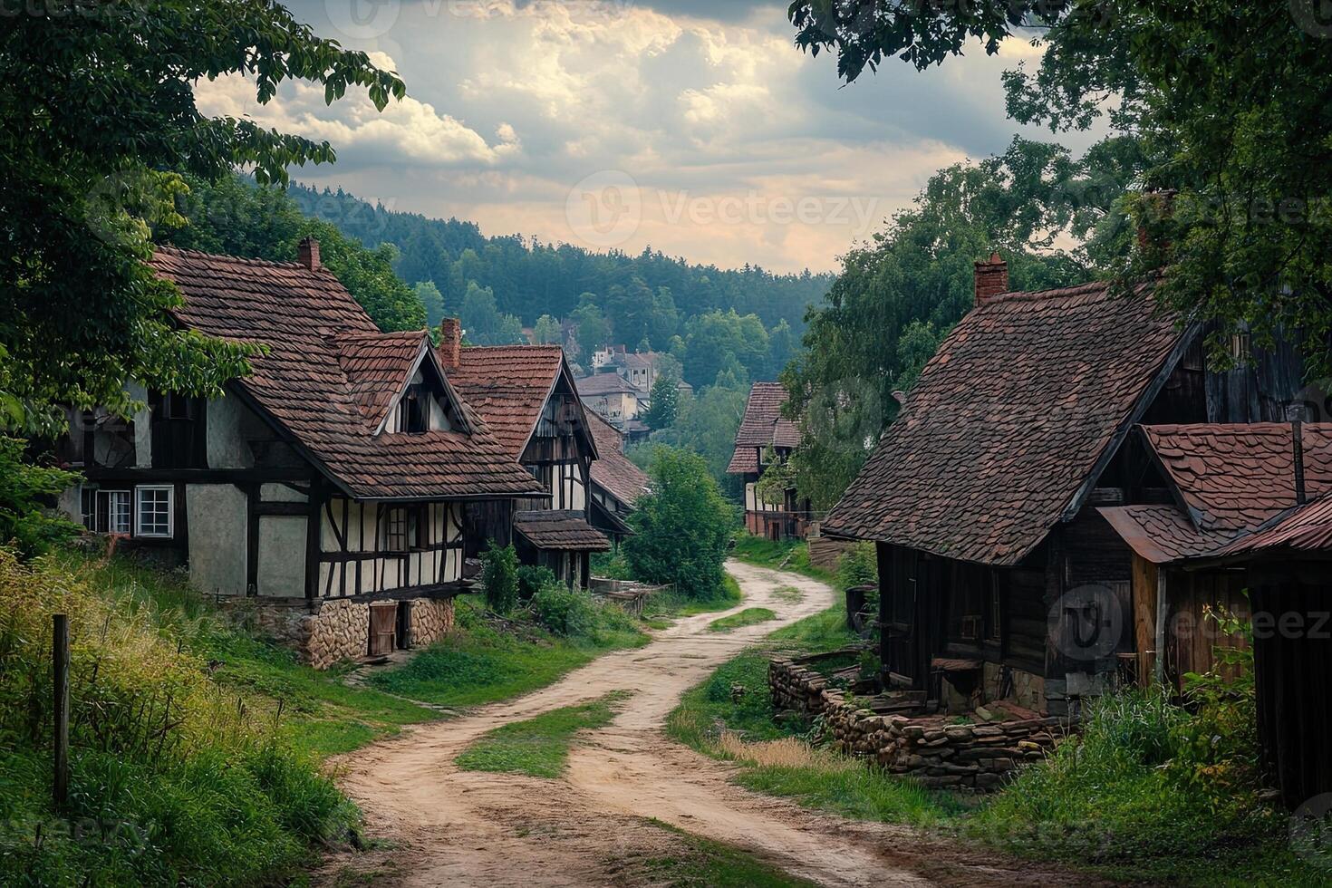 Picturesque village road with traditional timber-framed houses nestled in a lush green valley under a dramatic sky. photo