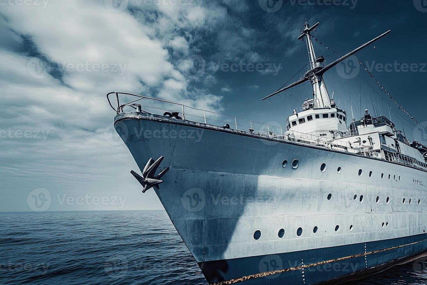A close-up of a ship's bow against a dramatic sky. photo