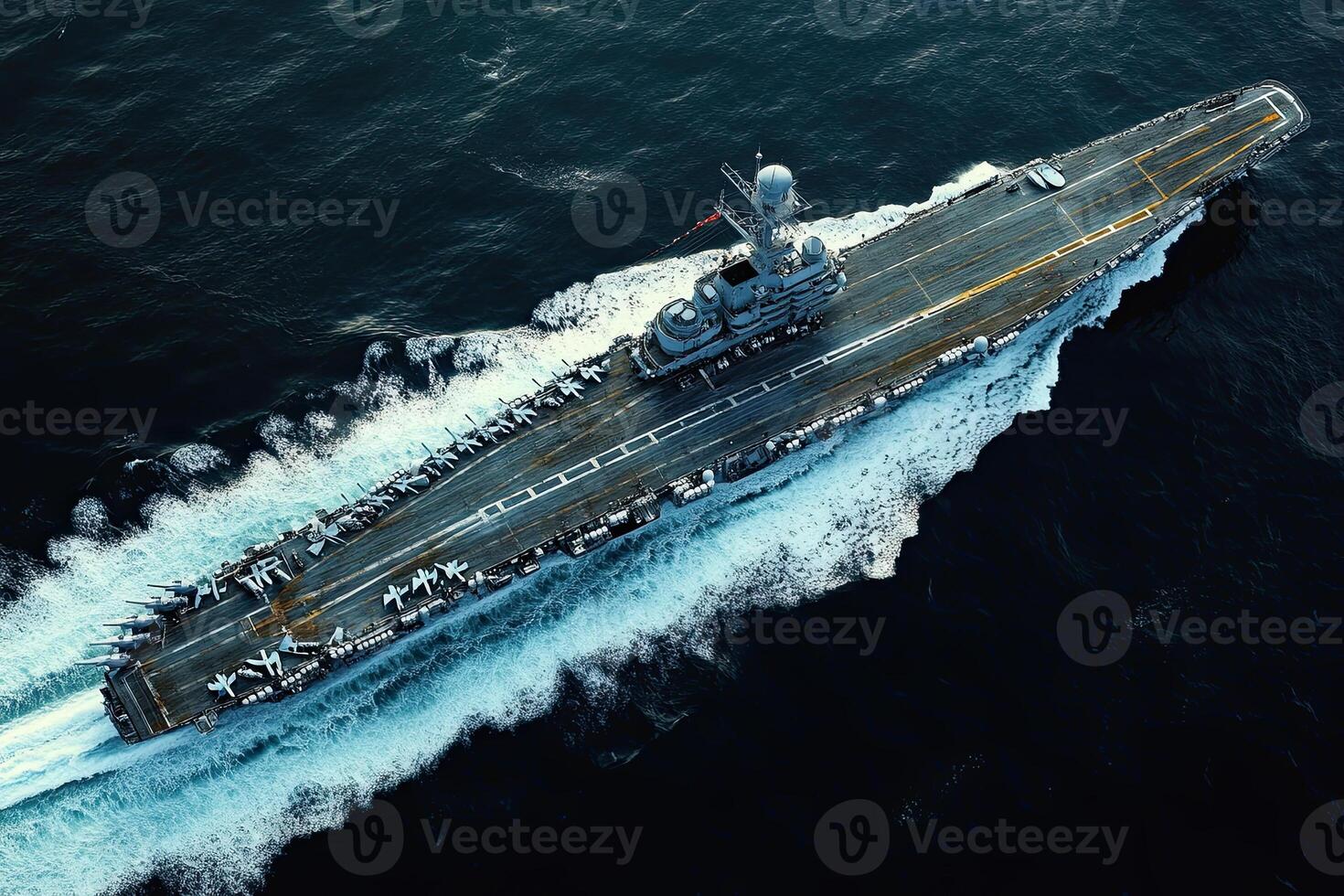 Aerial view of a naval aircraft carrier at sea. photo