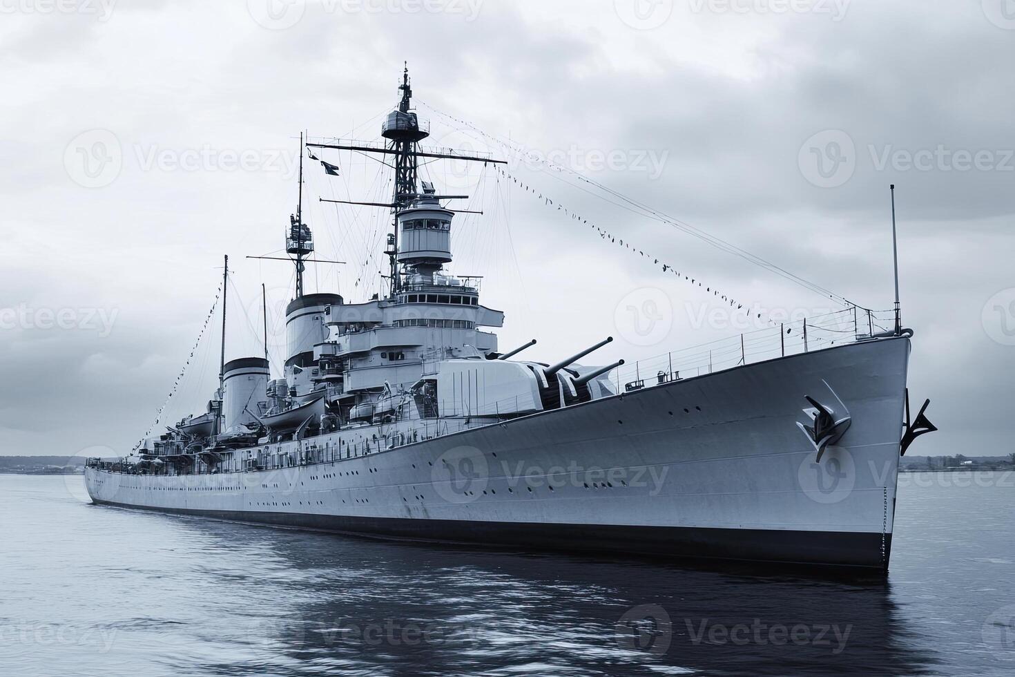 Historic battleship anchored in calm waters. photo