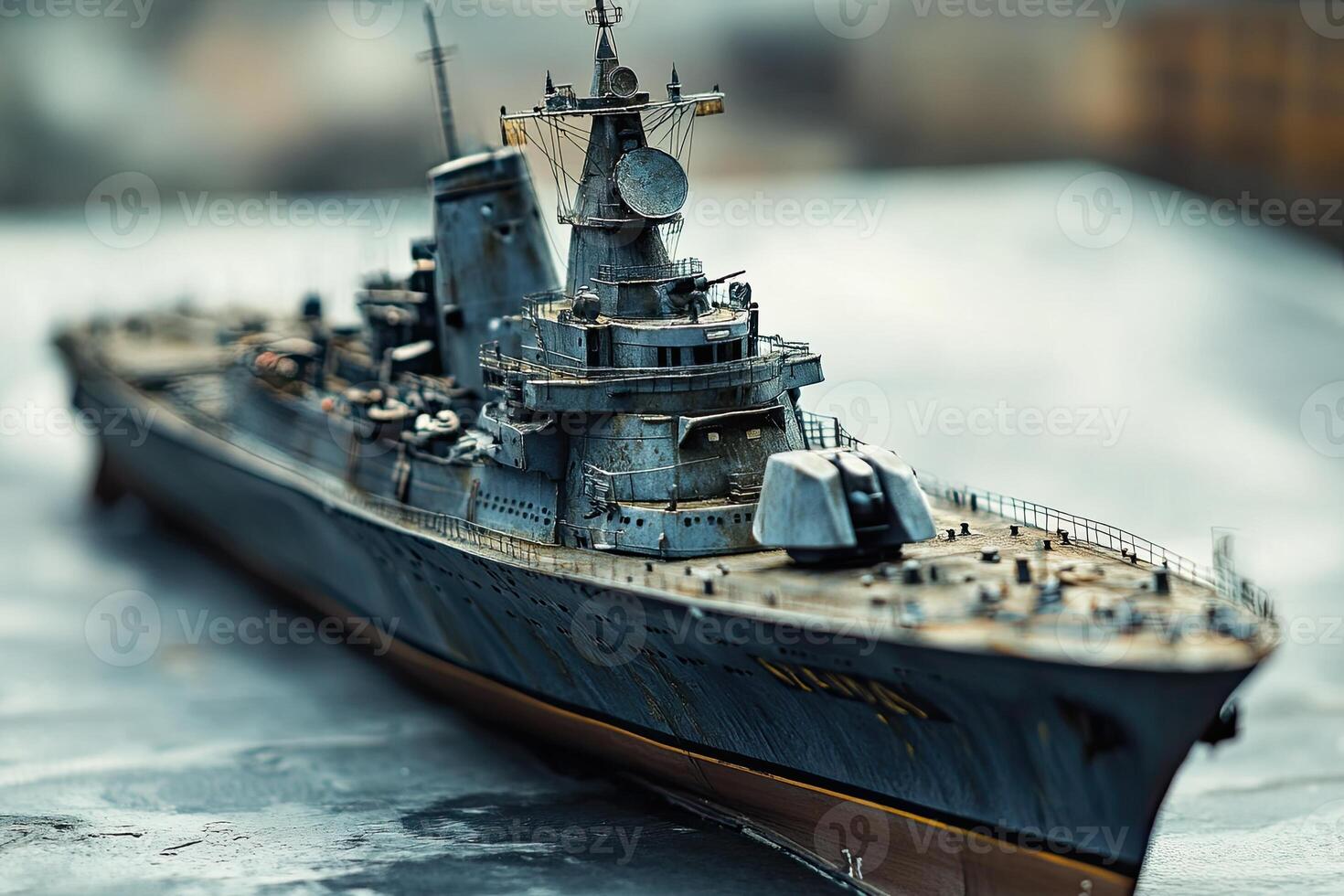 Detailed model of a battleship on a textured surface. photo