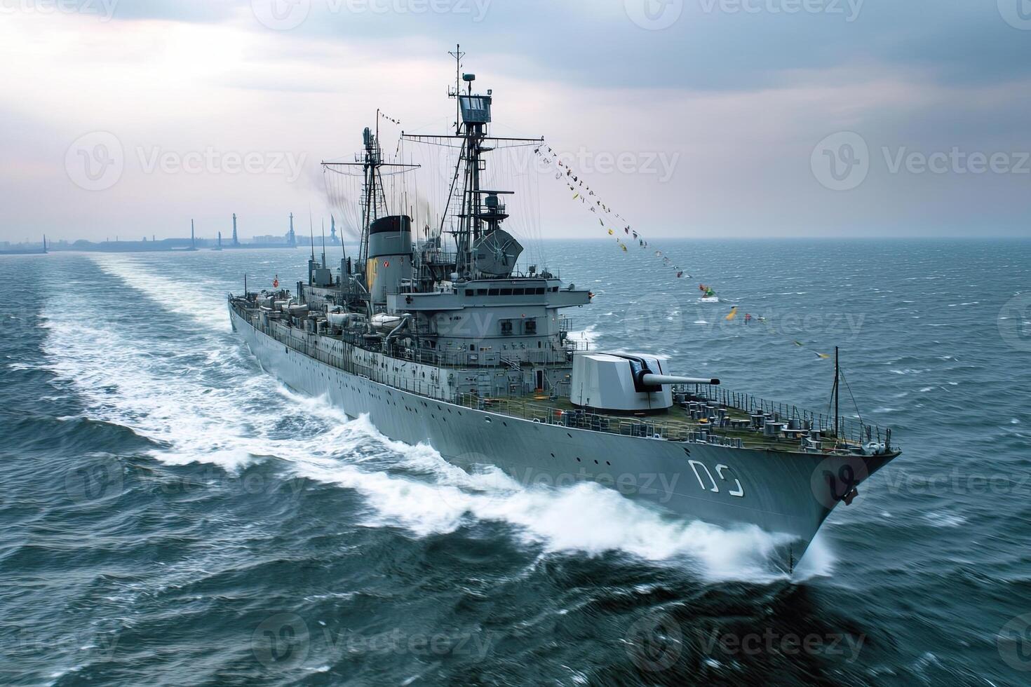 Naval ship navigating through the ocean waves. photo