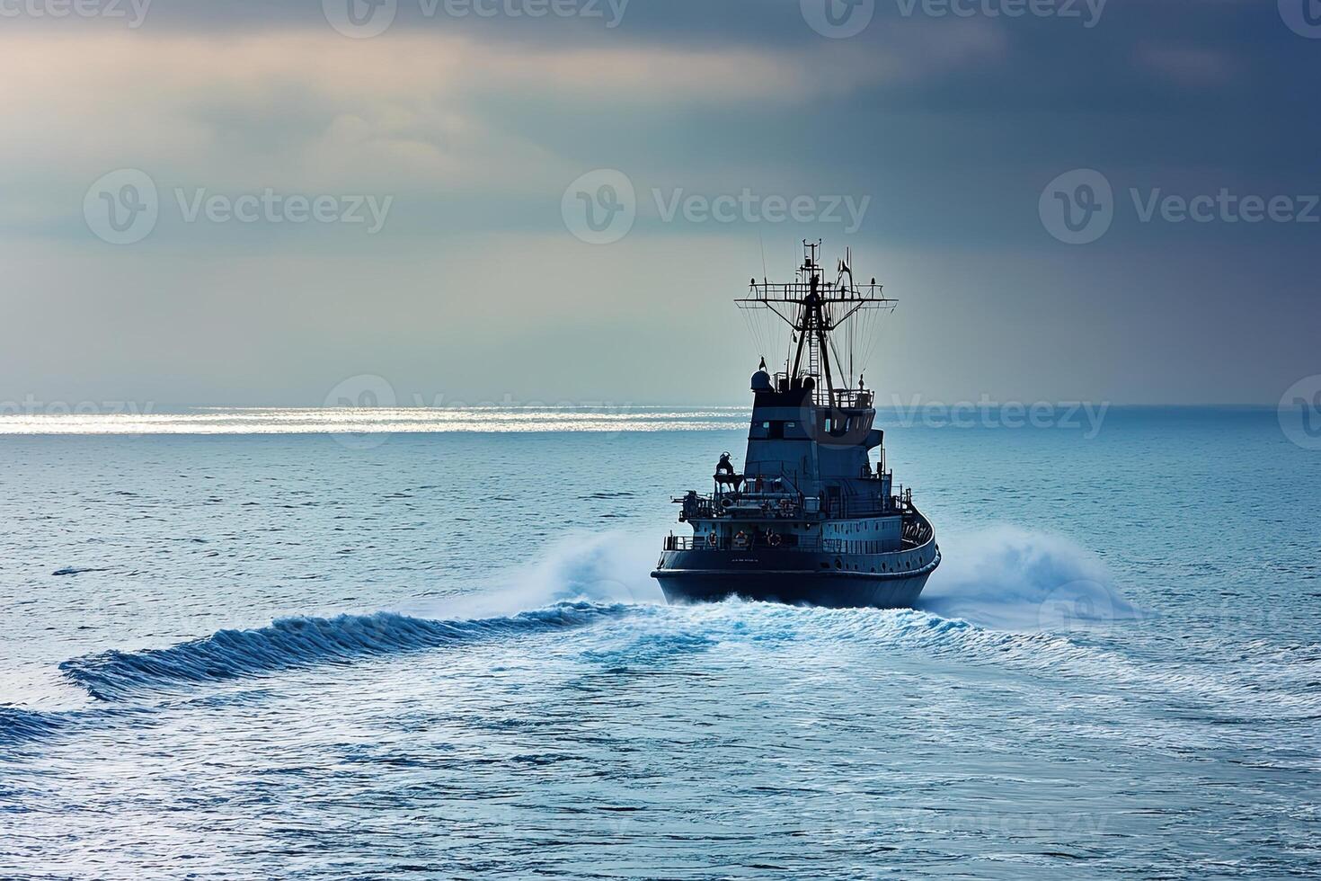 Tugboat navigating through calm waters under a cloudy sky. photo