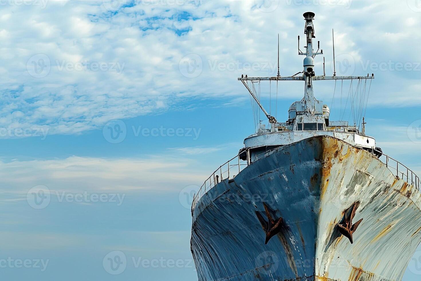 Rusty ship bow against a cloudy sky. photo